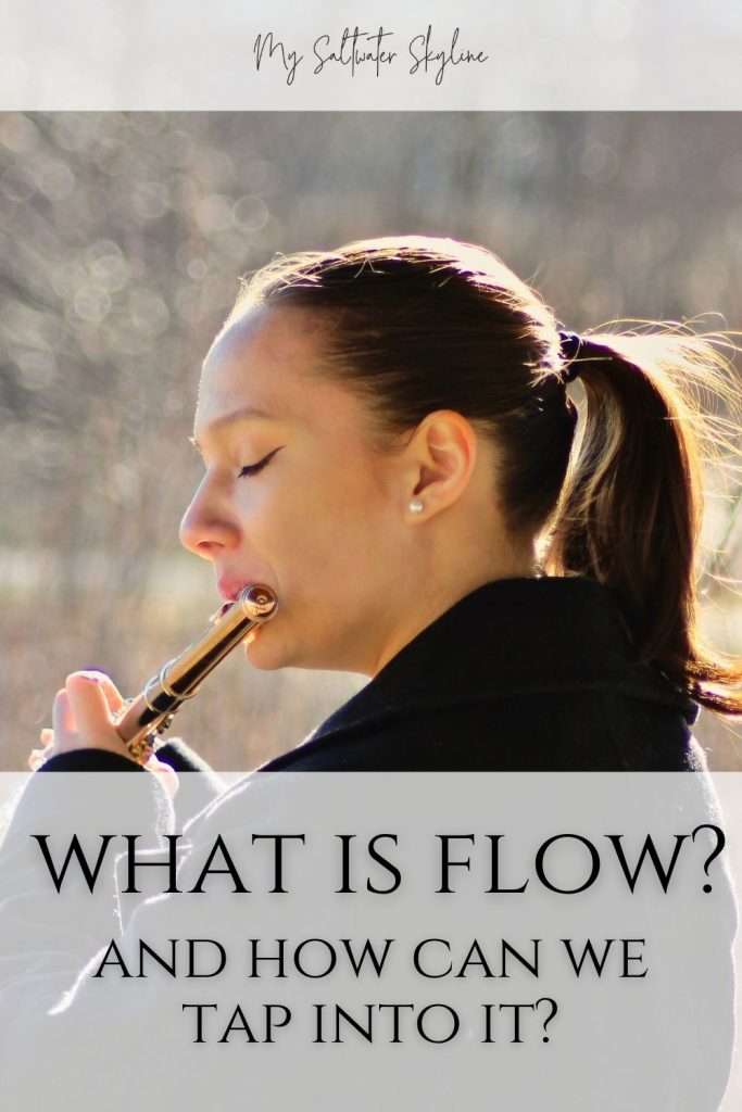 woman-playing-flute-eyes-closed-in-flow-what-is-flow-blog-post