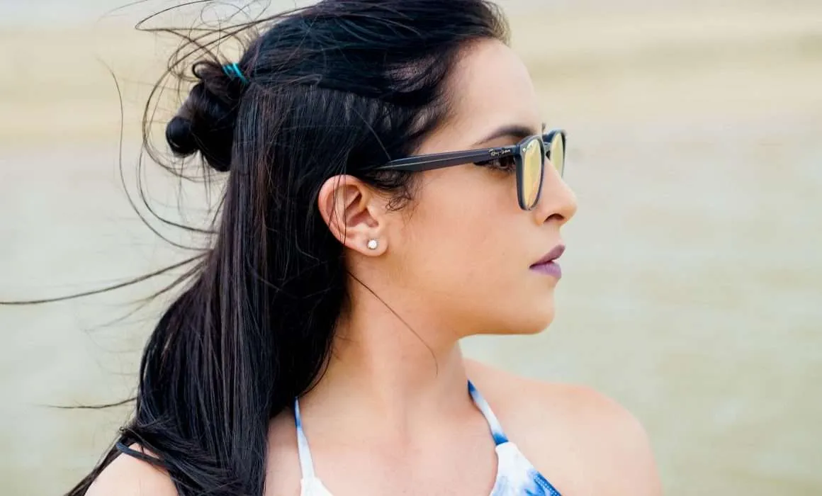 woman-dark-hair-glasses-looking-off-to-right-contemplative