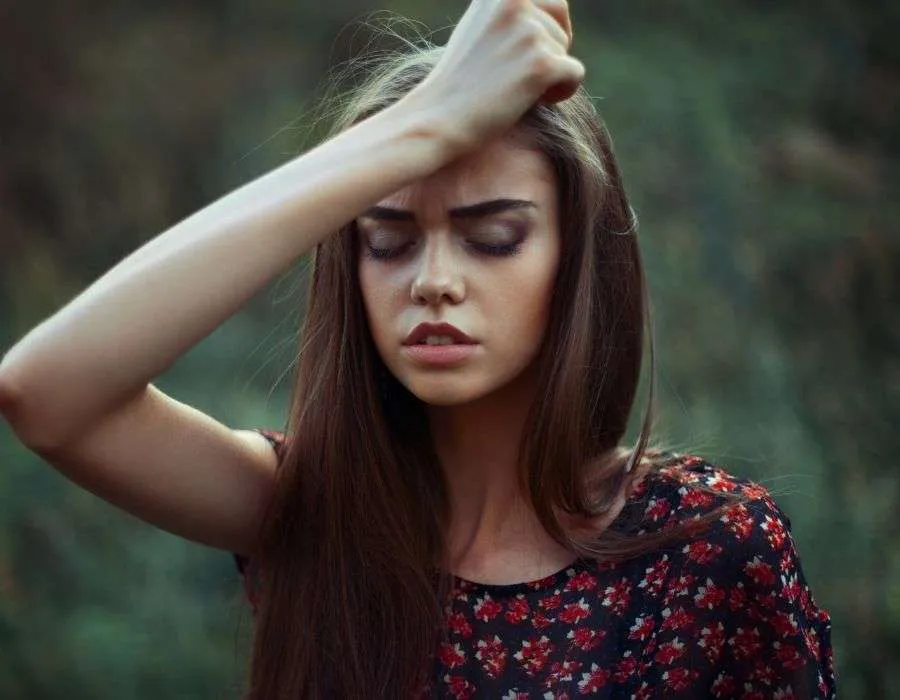 woman-dark-hair-hand-to-forehead-hard-times-make-you-stronger-blog-post