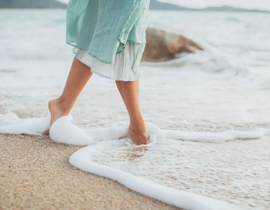 feet-walking-on-beach-in-water-lifes-abundance-blog-post