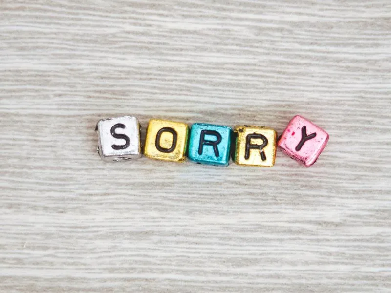 stop-apologizing-sorry-in-letters-on-table-blog-post