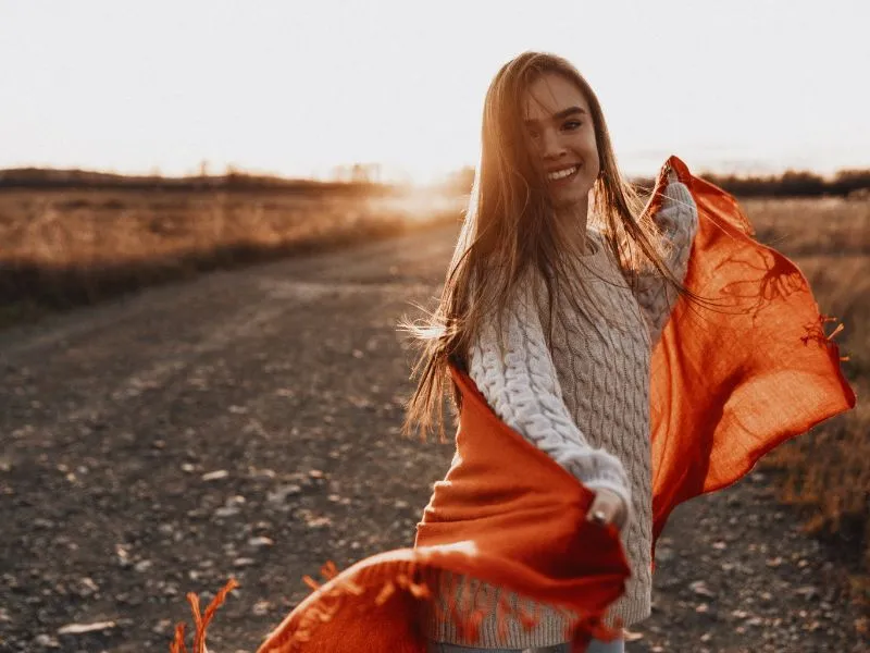 woman-sunset-rust-coloured-scarf-smiling-i-am-enough-blog-post