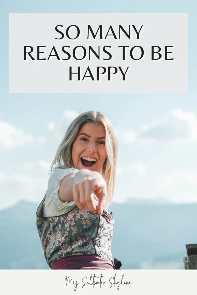 reasons to be happy pin woman blonde hair-smiling at camera